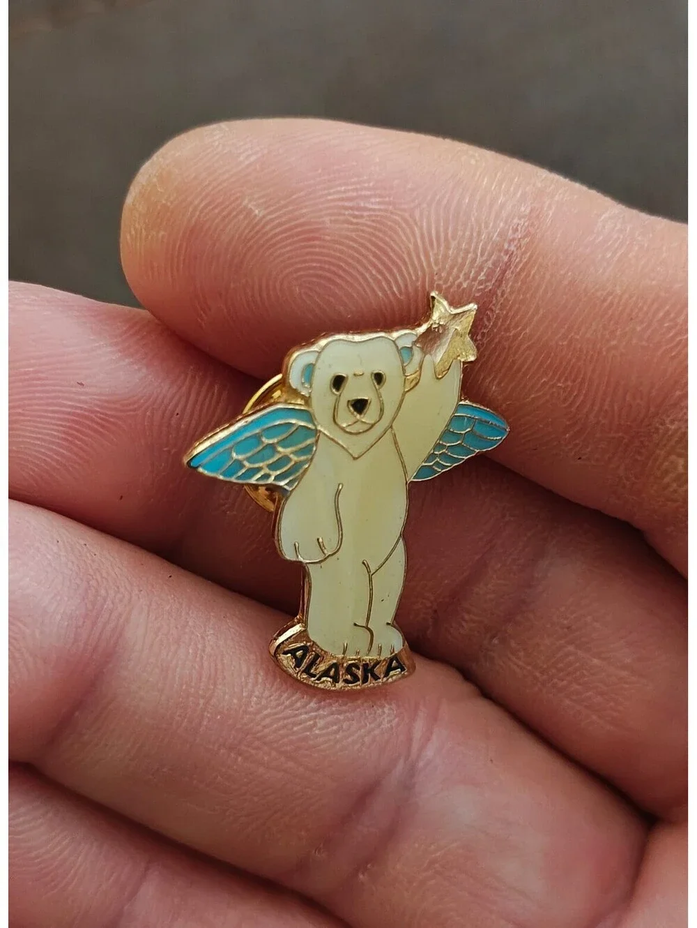 1980s Alaskan Polar Bear Guardian Angel Gold Tone Enamel Pin.